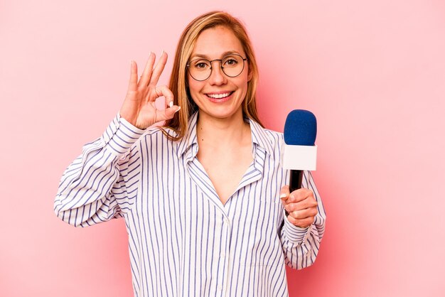 Cheerful and confident showing ok gesture