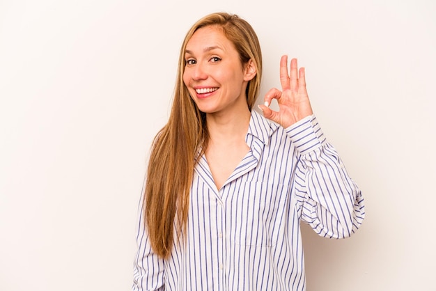 Cheerful and confident showing ok gesture