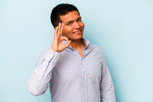 Cheerful and confident showing ok gesture