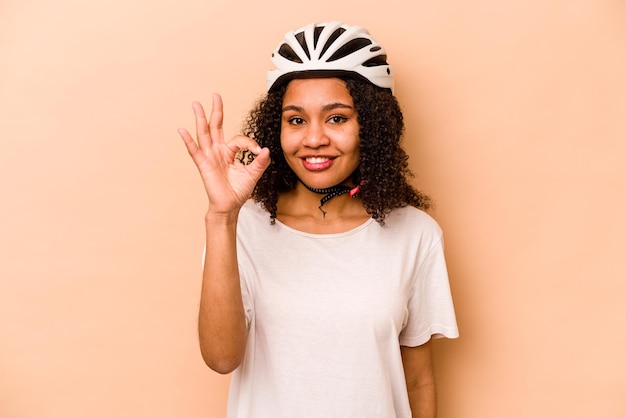 Cheerful and confident showing ok gesture