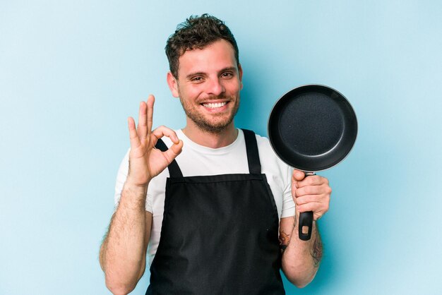 Cheerful and confident showing ok gesture