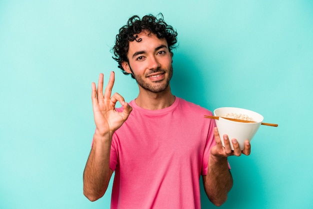 Cheerful and confident showing ok gesture