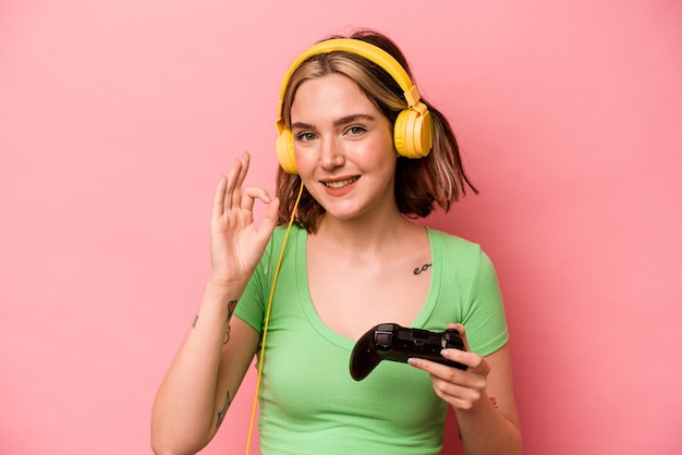 Cheerful and confident showing ok gesture