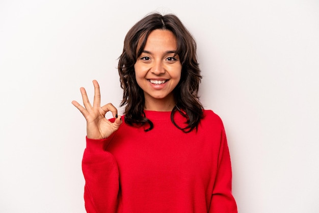 Cheerful and confident showing ok gesture