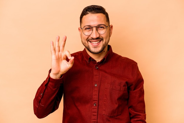 Cheerful and confident showing ok gesture