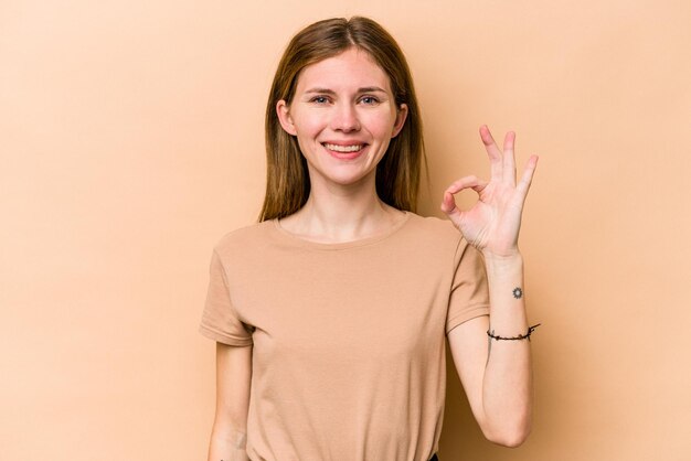 Photo cheerful and confident showing ok gesture