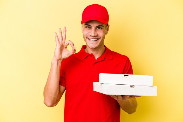 Cheerful and confident showing ok gesture