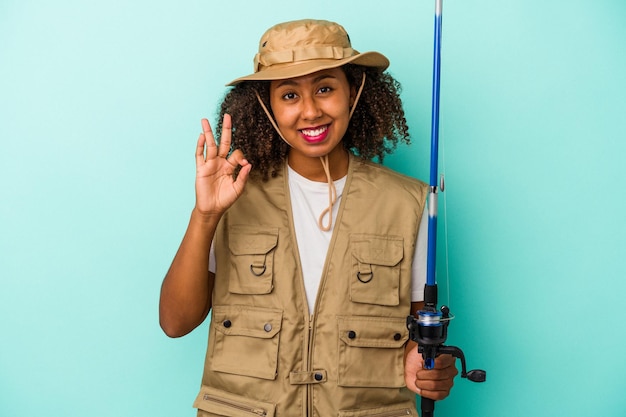 Cheerful and confident showing ok gesture