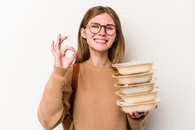 Cheerful and confident showing ok gesture