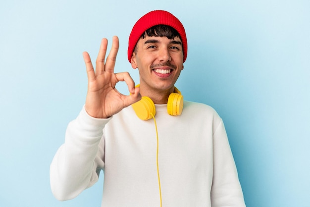 Cheerful and confident showing ok gesture