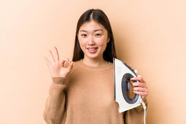 Cheerful and confident showing ok gesture