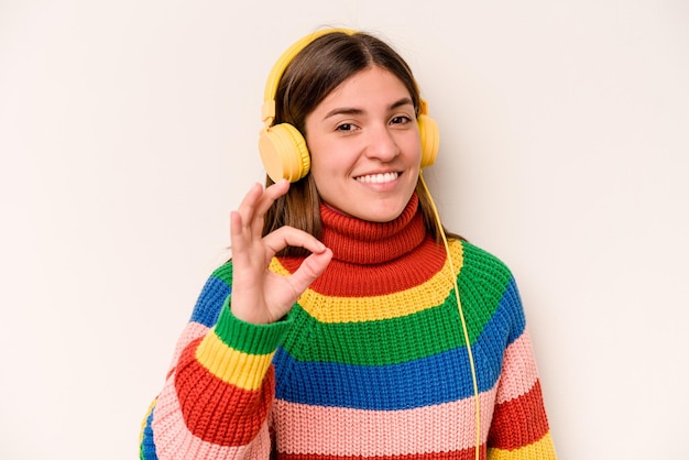 Cheerful and confident showing ok gesture