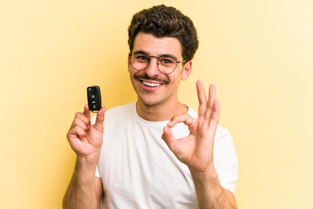 Cheerful and confident showing ok gesture