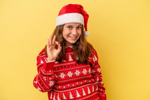 Cheerful and confident showing ok gesture