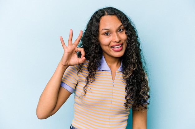 Cheerful and confident showing ok gesture