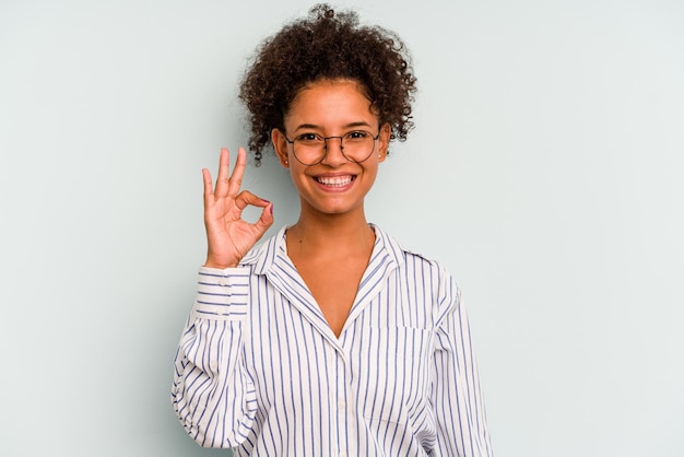 Cheerful and confident showing ok gesture