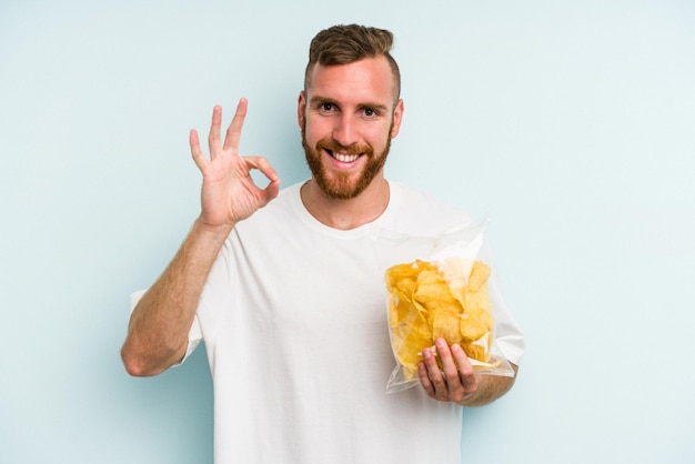 Cheerful and confident showing ok gesture