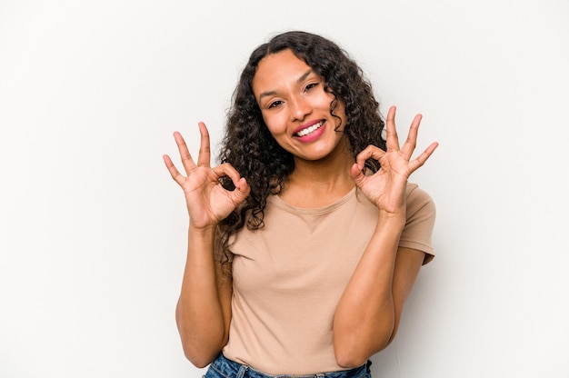 Cheerful and confident showing ok gesture