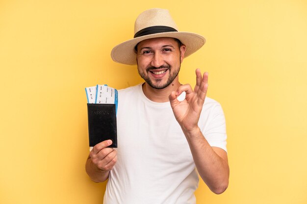 Cheerful and confident showing ok gesture