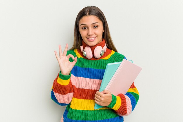 Cheerful and confident showing ok gesture