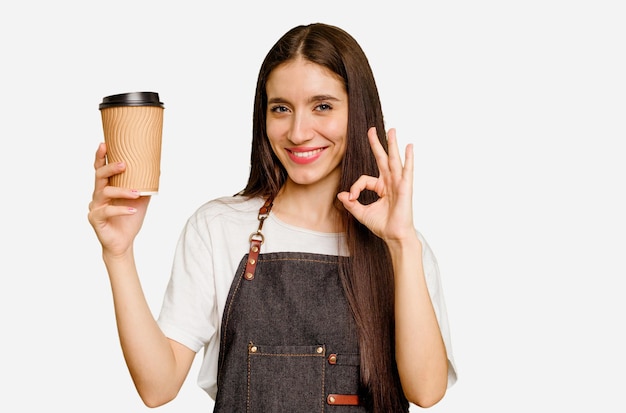 Cheerful and confident showing ok gesture