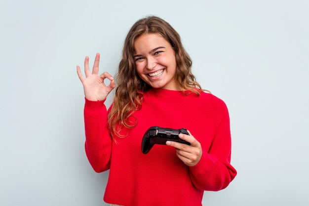 Cheerful and confident showing ok gesture