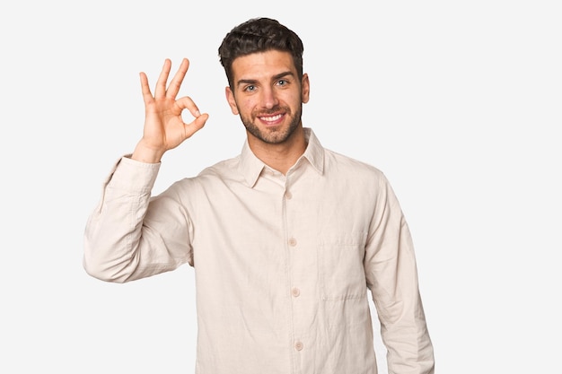 Cheerful and confident showing ok gesture