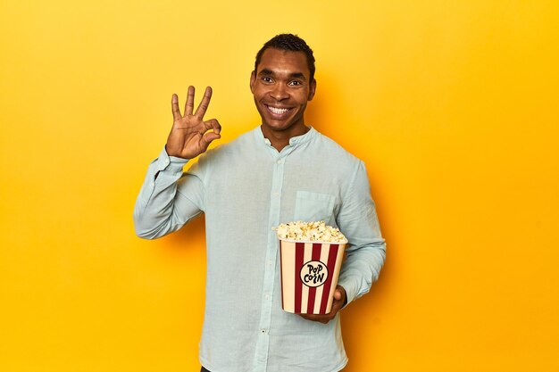 Cheerful and confident showing ok gesture