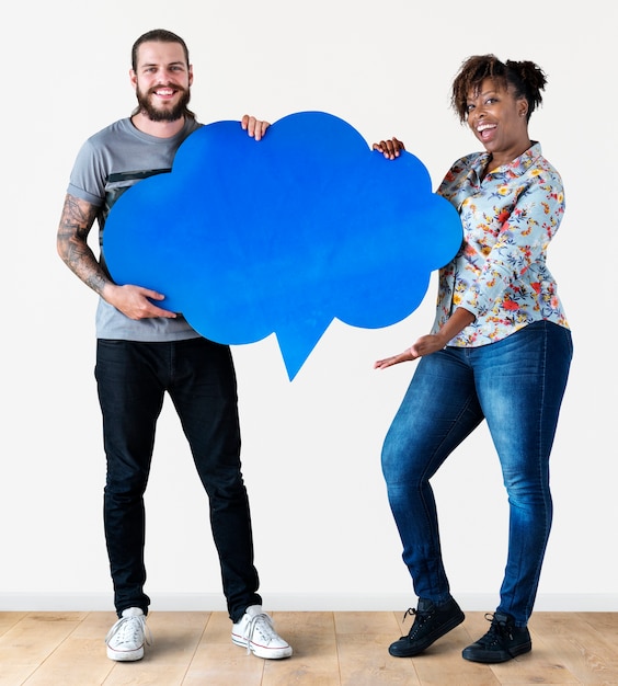 Cheerful couple holding speech bubble icon