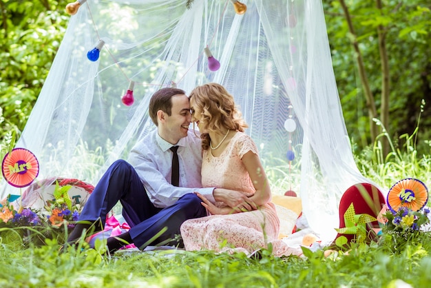 Cheerful couple in the meadow