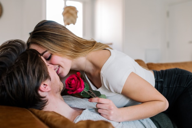 Cheerful couple on sofa