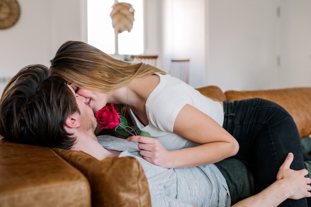 Cheerful couple on sofa