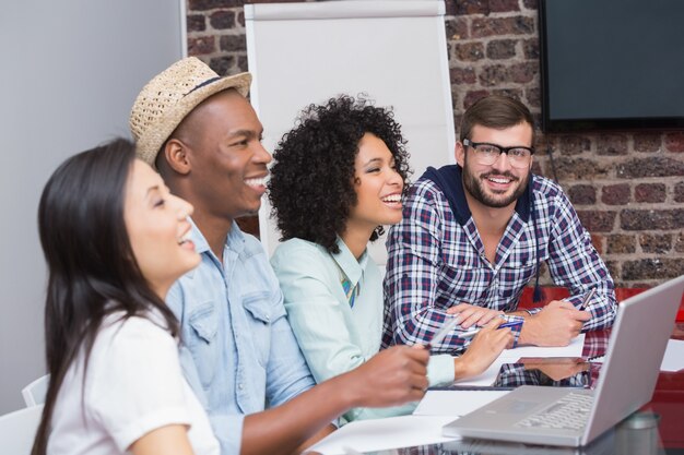 Cheerful creative business team in meeting