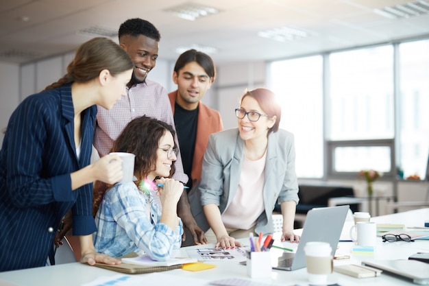 Cheerful Creative Team Working in Office