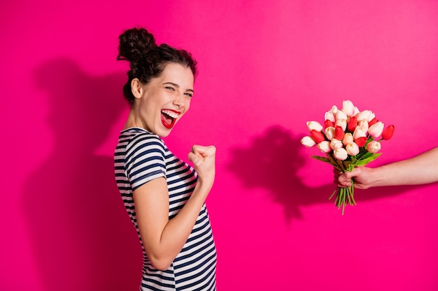 Cheerful cute girl on a pink background