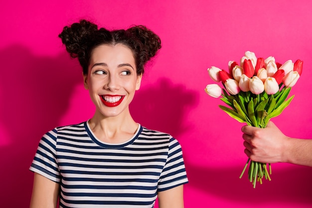 Cheerful cute girl on a pink background