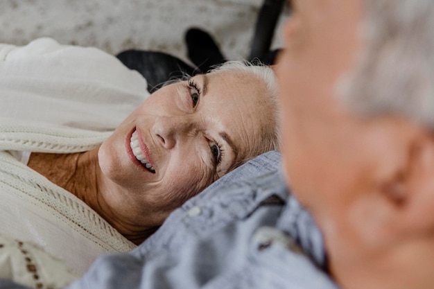 Cheerful elderly couple in a bed