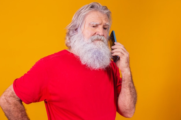 Cheerful elderly man talking on the phone