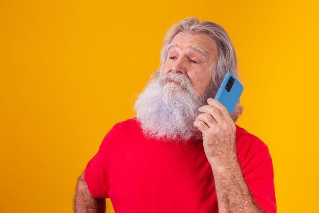 Cheerful elderly man talking on the phone