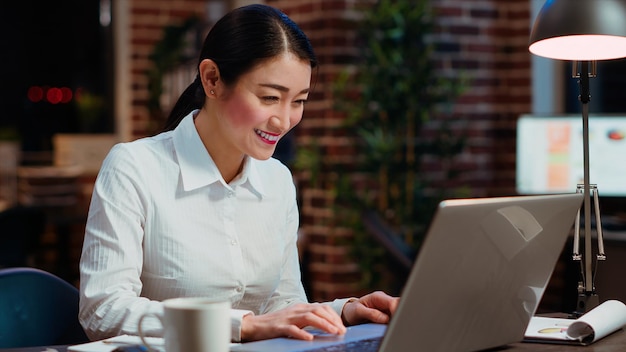 Cheerful employee dancing in office feeling excited after learning of upcoming promotion