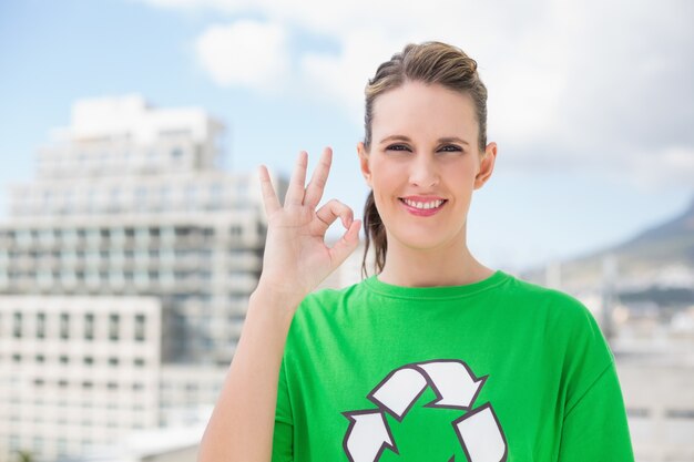 Cheerful environmental activist making okay gesture