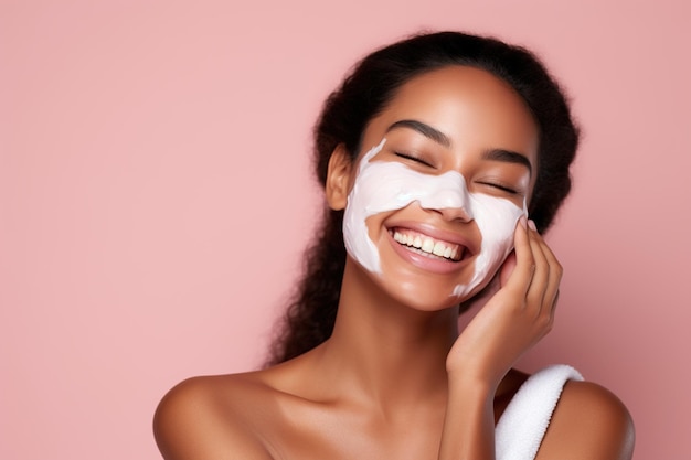 Cheerful ethnic woman applying cream on face before sleep