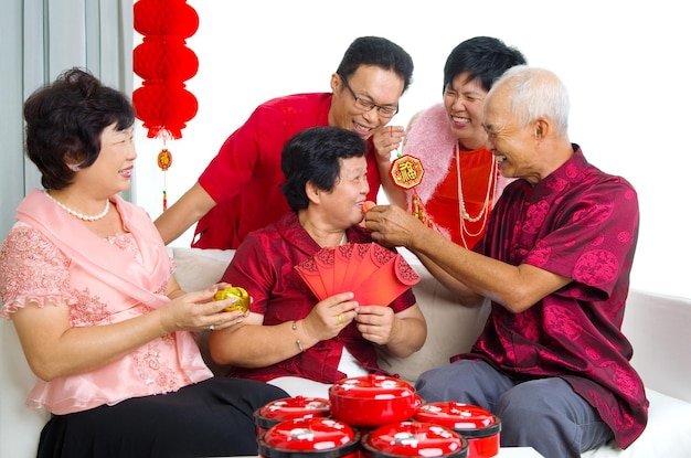 cheerful family celebrating traditional festival while sitting at home