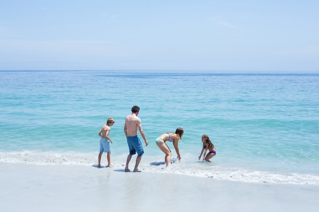 Cheerful family enjoying at beach 