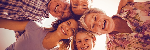 Cheerful family forming huddle