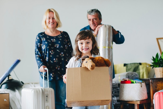 Cheerful family moving into a new house