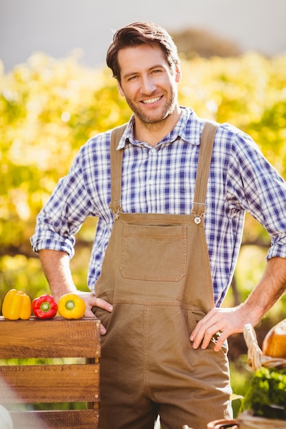 Cheerful farmer with hands on hips