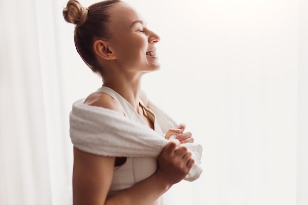 Cheerful female athlete at home