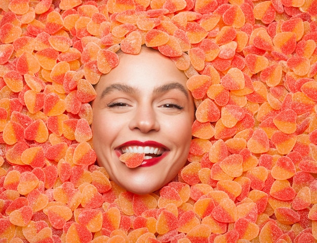 Cheerful female enjoying fruit sweets