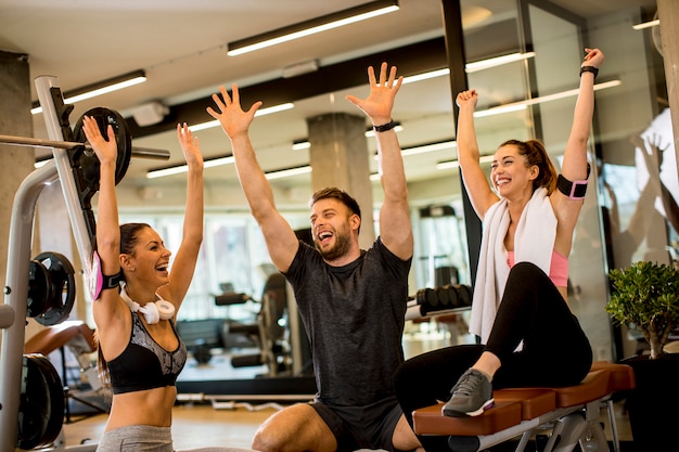 Cheerful fit fitness team in the gym